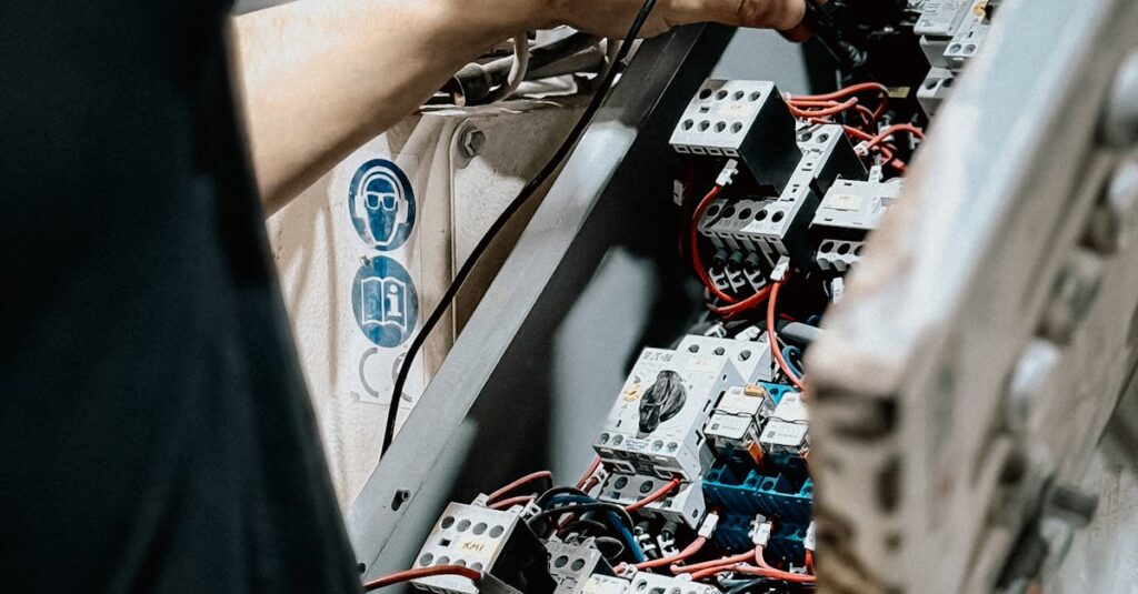 pexels-photo-33694019-33694019 Technician adjusting wires in an electrical control panel for maintenance
